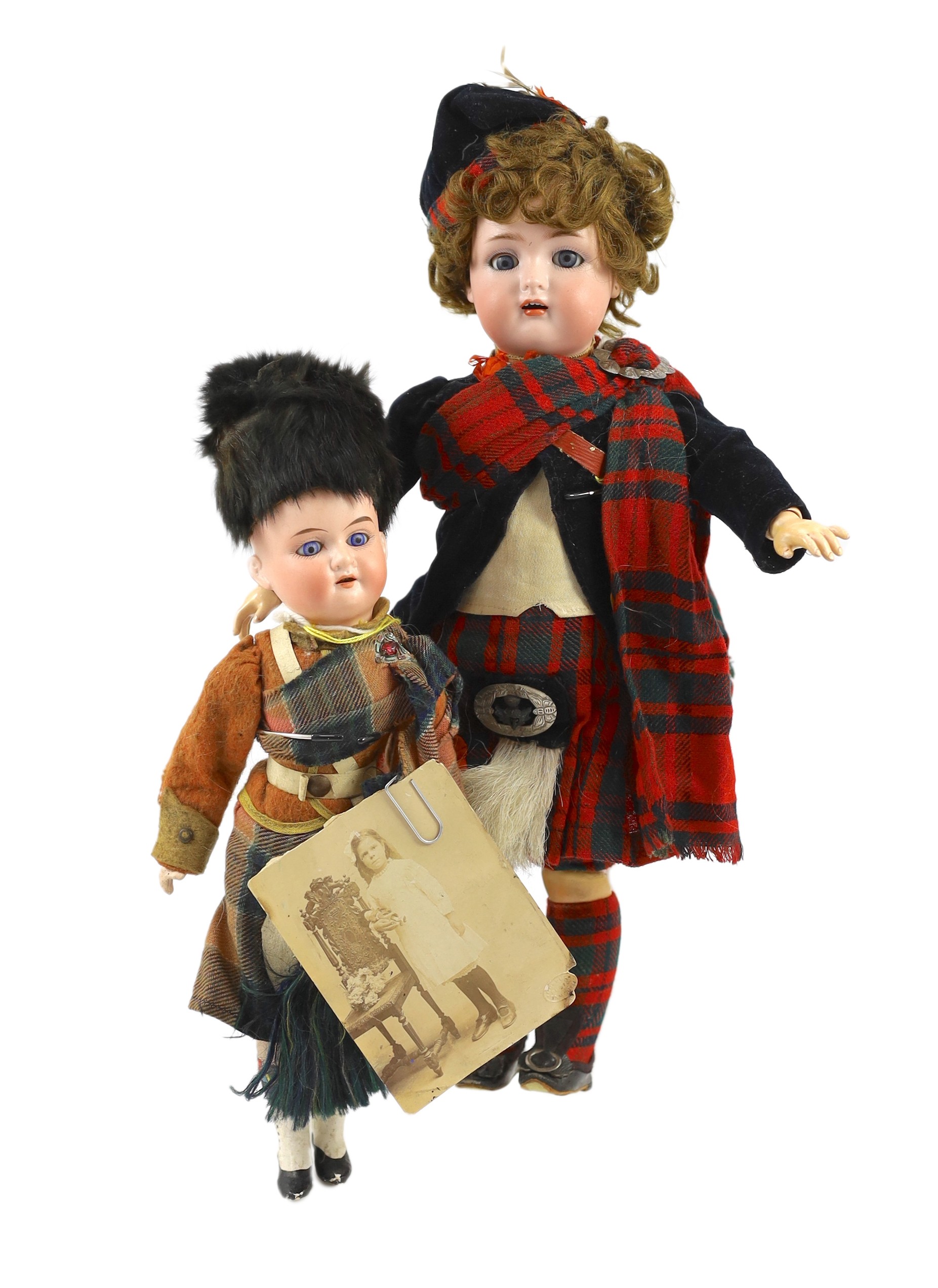 An Armand Marseille bisque Scottish soldier doll, German, circa 1900, 15in. (2)